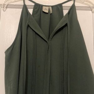 Green tank with tassel accents
